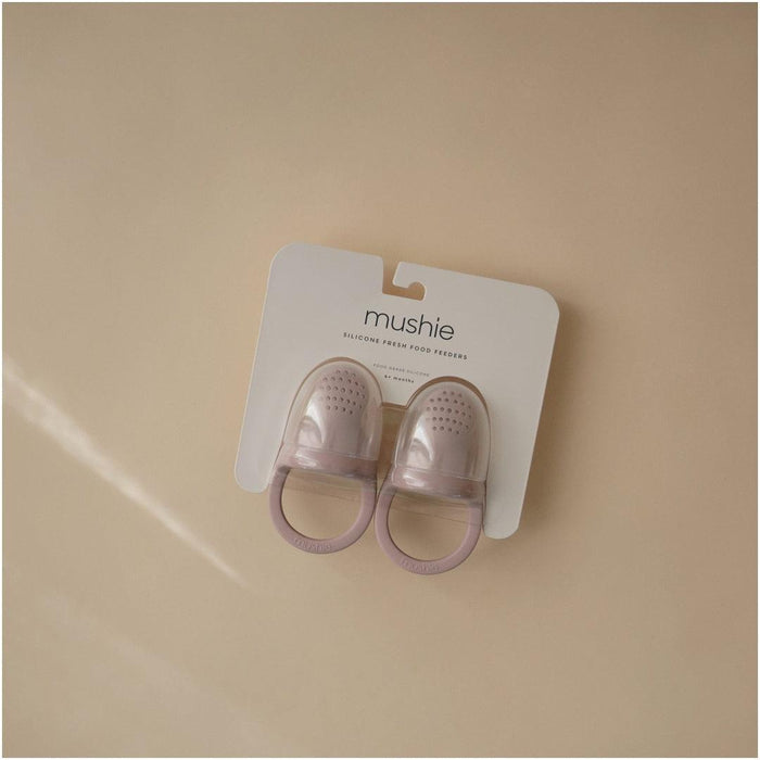 
    Alimentador Infantil de Silicone Mushie 2 Peças Soft Lilac - Mushie Babytunes
  