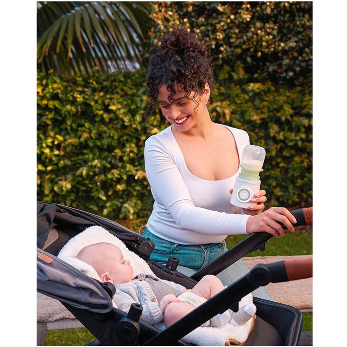 
    Aquecedor De Mamadeiras Momcozy Portátil e Sem Fio - Momcozy Babytunes
  