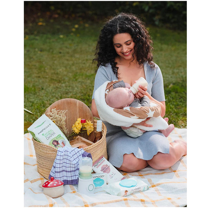
    Aquecedor De Mamadeiras Momcozy Portátil e Sem Fio - Momcozy Babytunes
  