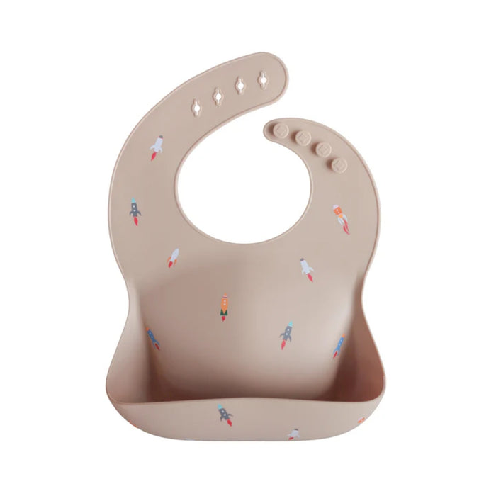 
    Babador De Silicone Infantil Mushie Rocket Ship - Mushie Babytunes
  