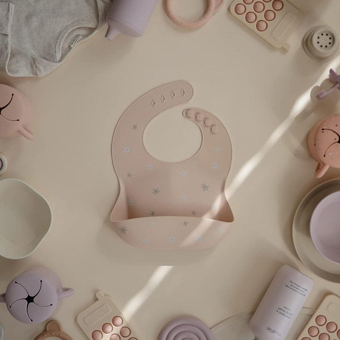 
    Babador De Silicone Infantil Mushie Daisy - Mushie Babytunes
  