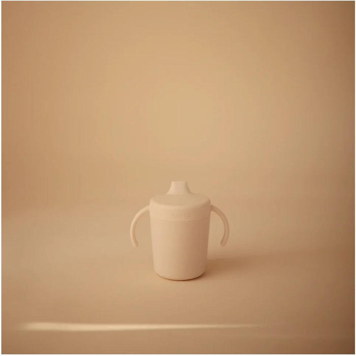 
    Copo de Treinamento Infantil Mushie Sippy Ivory - Mushie Babytunes
  