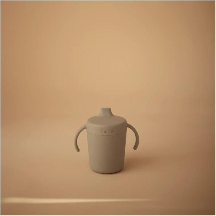 
    Copo de Treinamento Infantil Mushie Sippy Sage - Mushie Babytunes
  