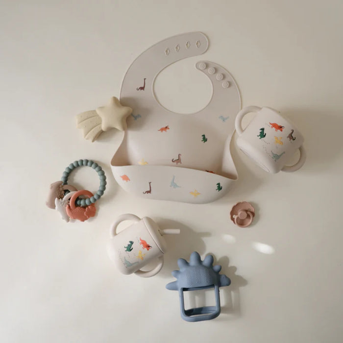 
    Porta Snack Infantil Mushie Dinosaurs - Mushie Babytunes
  