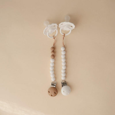Prendedor De Chupeta Infantil Mushie EVA White - Instruções de Limpeza
