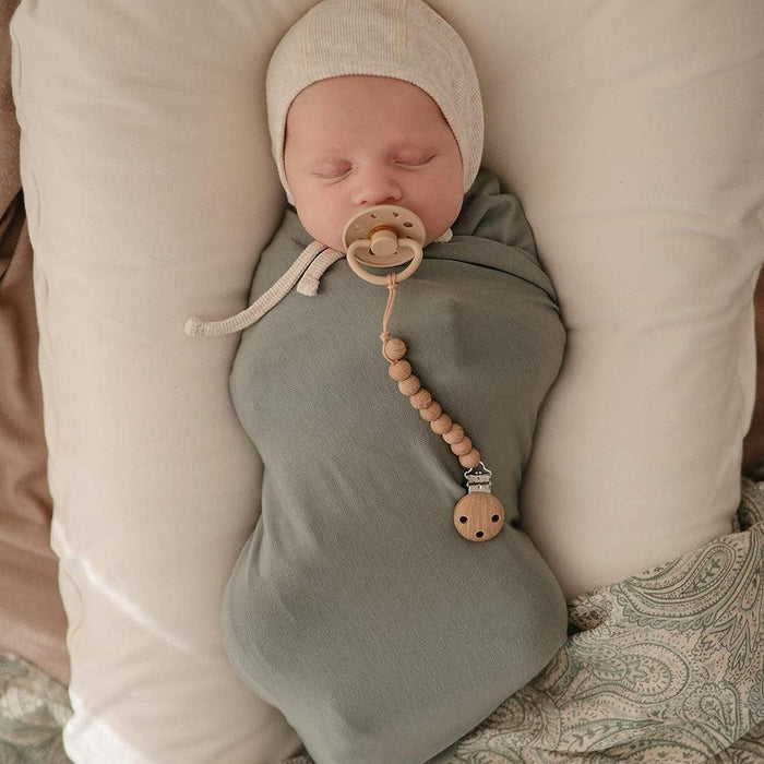 
    Prendedor De Chupeta Infantil Mushie Hera Faux Wood - Mushie Babytunes
  