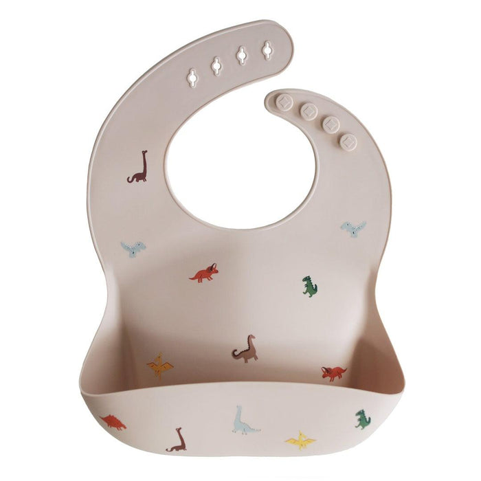 
    Babador De Silicone Infantil Mushie Dinosaurs - Mushie Babytunes
  